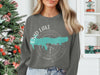 Crewneck sweatshirt with a compass design centered around a teal map of Enid Lake, Mississippi.