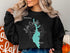 Black sweatshirt with "Beautiful Lake Cascade Idaho" and a turquoise map outline.