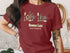 Maroon t-shirt with Donner Lake California text and nautical graphic elements.