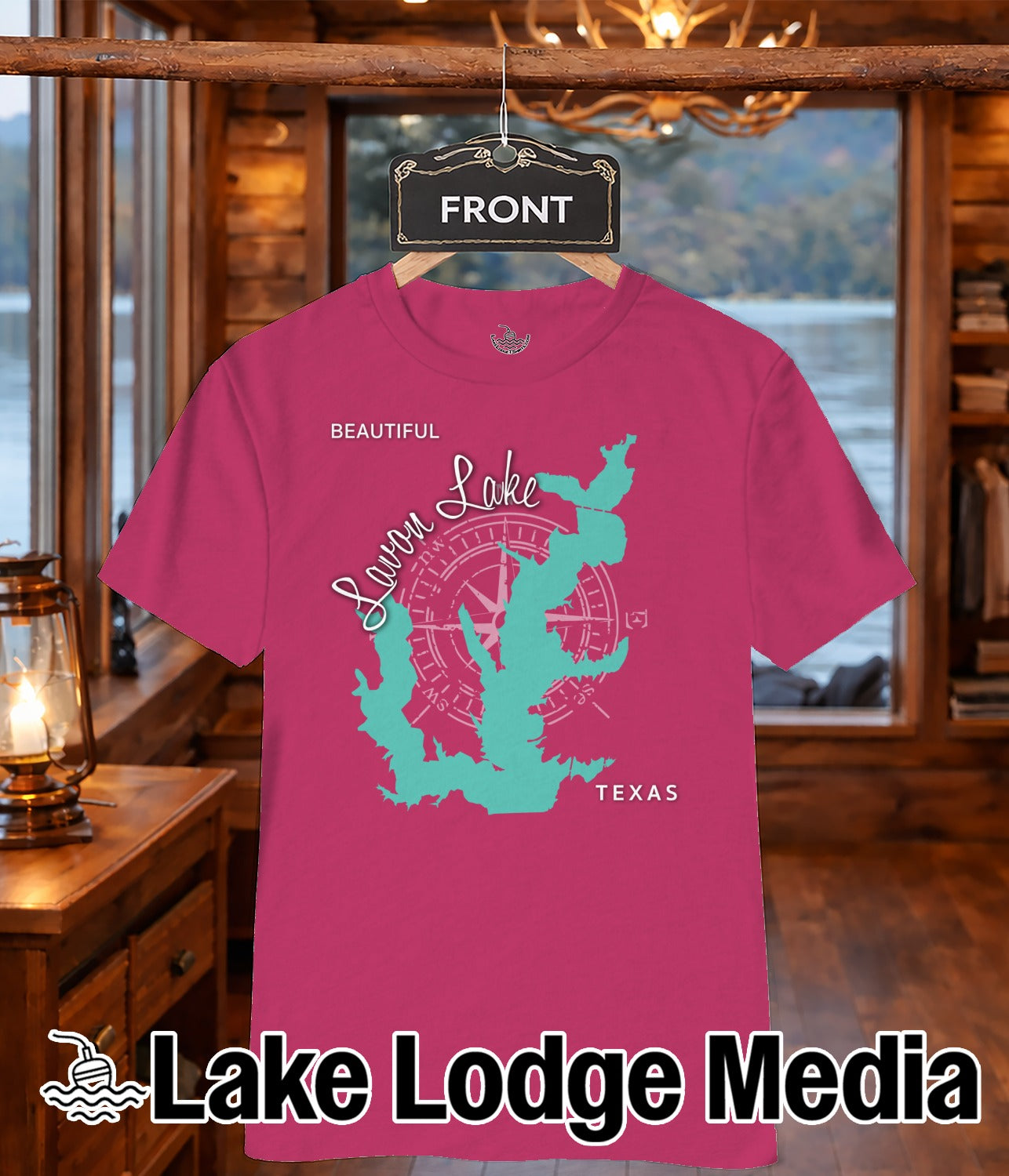 Pink t-shirt with teal compass rose and "Lake Lodge Media" text.