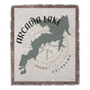 Woven blanket featuring Arcadia Lake map outline with compass rose and text Oklahoma.