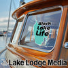Black Lake Life sticker on a boat window with Lake Lodge Media logo.