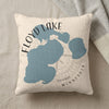 Floyd Lake Minnesota map design on a textured cream pillow with a grey throw.