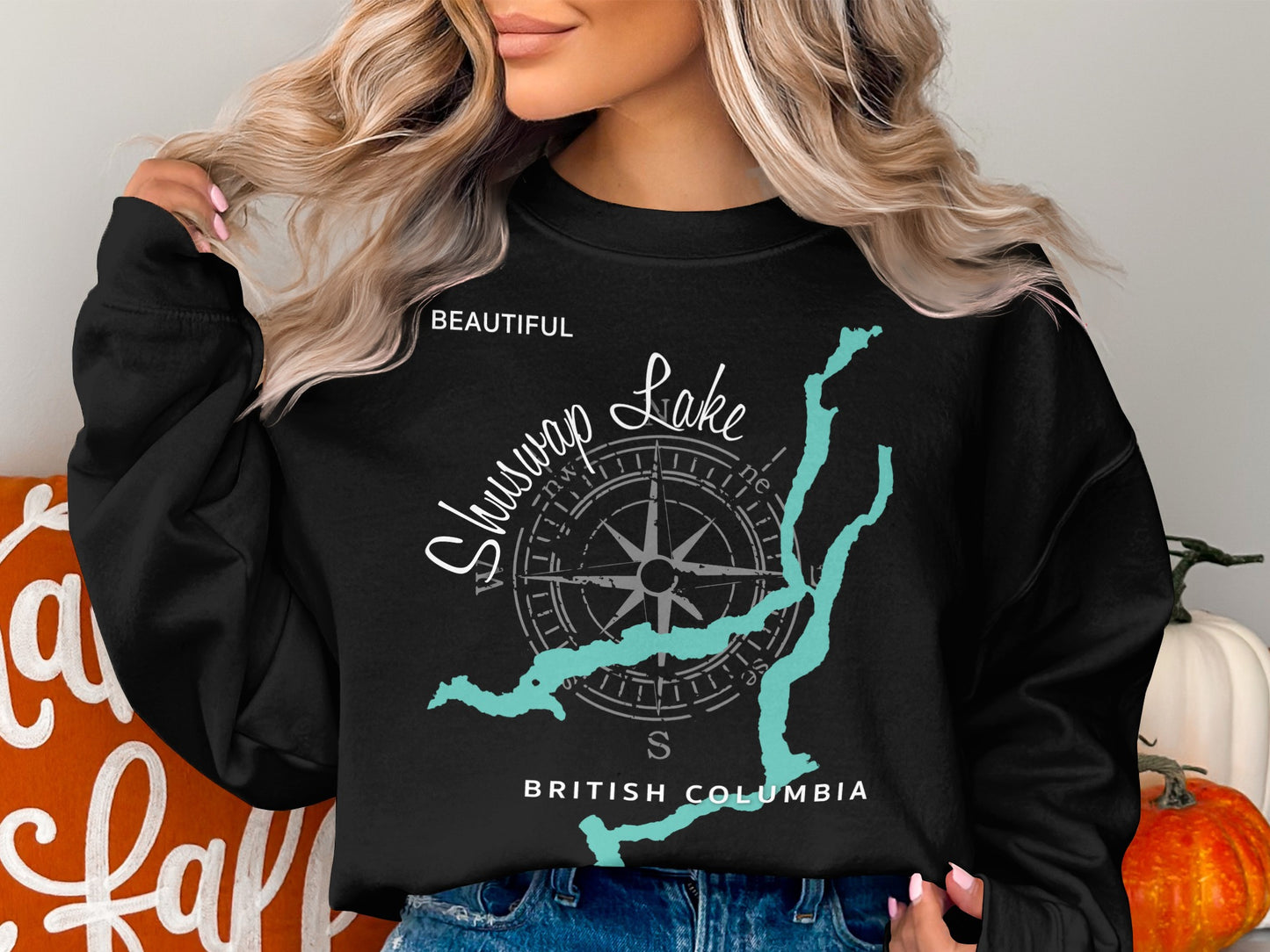 Black sweatshirt with "Beautiful Shuswap Lake British Columbia" and compass design.