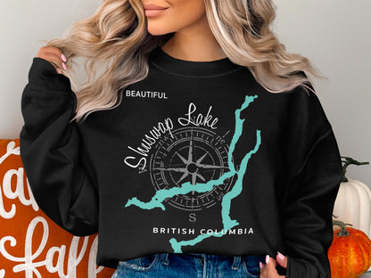 Black sweatshirt with "Beautiful Shuswap Lake British Columbia" and compass design.