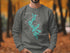 Dark grey sweatshirt with a teal map of Moosehead Lake, Maine.