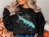 Black sweatshirt with a teal map of Grapevine Lake and compass rose graphic.