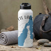 White water bottle with "ETTE LAKE" text, blue geographic silhouette, and compass design.