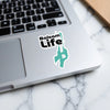 Balsam Life sticker with a teal lake outline on a laptop.