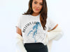 White t-shirt with blue map design of Belews Lake, North Carolina.