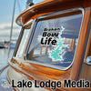 Sticker on boat window reads "Broken Bow Life" with a lake outline; "Lake Lodge Media" text below.