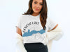White t-shirt with "Geneva Lake Wisconsin" and a compass rose graphic.