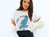 White t-shirt with blue Lake Tiorati map outline and compass graphic.