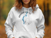 White hoodie with Abraham Lake Alberta compass and map design.