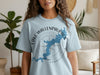 Light blue t-shirt with a blue map outline of Lake Wallenpaupack, Pennsylvania and compass.