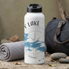White water bottle with "Y LAKE" text, compass graphic, and blue trees.