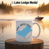 White mug with Lake Mascuppic map and compass design, Lake Lodge Media logo.