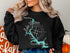 Black sweatshirt with a turquoise map of Lake Wateree, South Carolina, and compass rose.