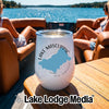 A white wine tumbler featuring Lake Mascuppic, New Hampshire, rests on a wooden boat table.