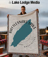 Woven blanket with Rattlesnake Lake map graphic, "Lake Lodge Media" and Washington text.