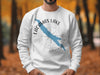 White sweatshirt with blue Lacamas Lake map and compass graphic and text.