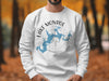 White sweatshirt featuring a blue Lake Monroe map with compass on a man.