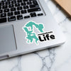 Teal graphic of Massachusetts coastline with "massabesic Life" text on laptop.