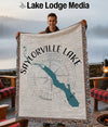 Man holding a blanket featuring Saylorville Lake, Iowa, and a compass rose.