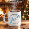 White mug with "Logan Martin Lake Alabama" and lake graphic on wooden table.