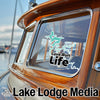 Sticker for Cave Run Life on a wooden boat, with Lake Lodge Media logo.