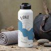 White thermos with black lid, "LAKE" text, compass, and blue lake graphic.