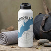White water bottle with "MARBLE FALLS" and blue map on compass background.