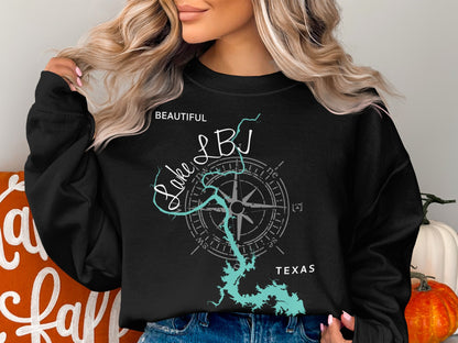 Black sweatshirt with "Beautiful Lake LBJ Texas" and compass on dark background.