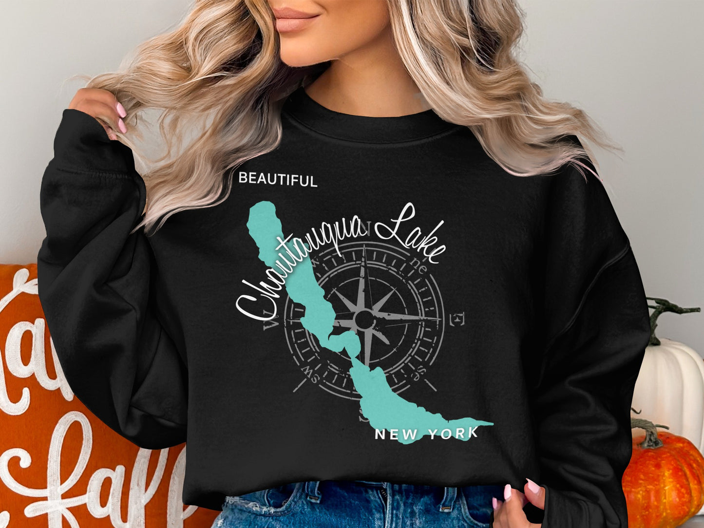 Black sweatshirt with a Chautauqua Lake, NY map and compass graphic.
