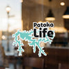Patoka Life sticker with turquoise lake outline on glass foreground.