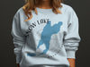 Light blue sweatshirt with Snow Lake Washington silhouette and compass design.