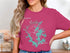 Pink t-shirt with "Beautiful Lake Martin Alabama" and a compass rose graphic.