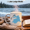 White mug with "Big Lake Arizona" map design, steaming hot, by a window.
