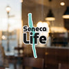 Seneca Life sticker with teal lake outline on glass door
