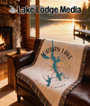 Woven blanket featuring Jordan Lake, Alabama map design on a brown leather couch.