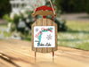 Christmas ornament shaped like a sled with "Merry Christmas From Baker Lake" text.