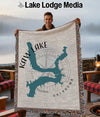 Woven blanket featuring Kaw Lake Oklahoma map, compass rose, and fringe.