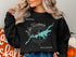 Black sweatshirt with "Beautiful Lake Wisconsin" and compass design.
