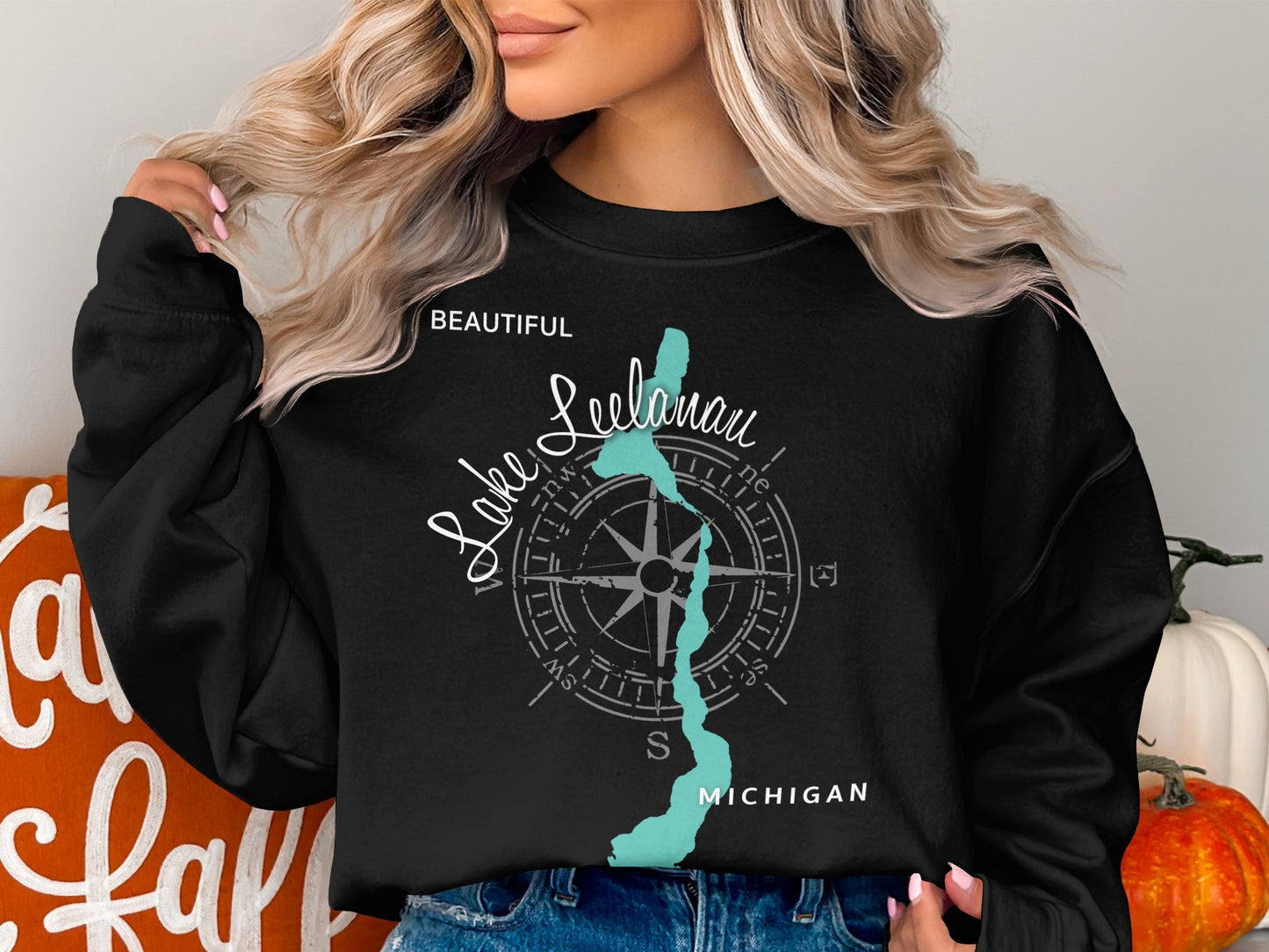 Black sweatshirt with "Beautiful Leelanau Lake Michigan" text and map illustration.