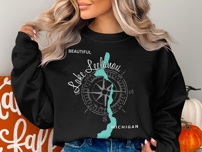Black sweatshirt with "Beautiful Leelanau Lake Michigan" text and map illustration.