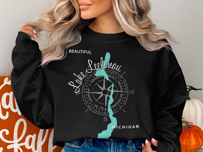 Black sweatshirt with "Beautiful Leelanau Lake Michigan" text and map illustration.