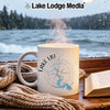 White mug with Lake LBJ map and compass design, steam rising.