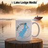 White mug with blue Lake Onota map graphic and compass rose on wooden post.
