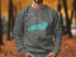 Gray sweatshirt with "Beautiful Lake Ontario" text and compass rose design.