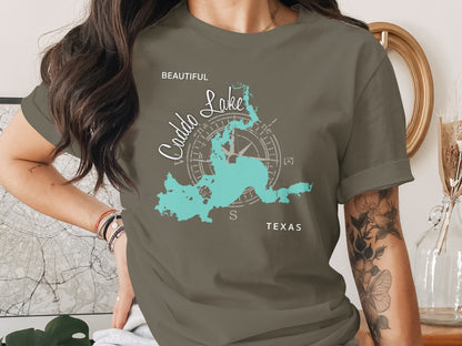 T-shirt with turquoise outline map of Caddo Lake, Texas and compass rose.
